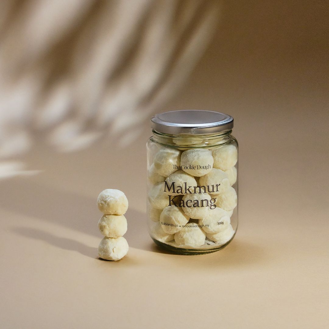 Jar of 'Makmur Kicang' cookies on a beige background