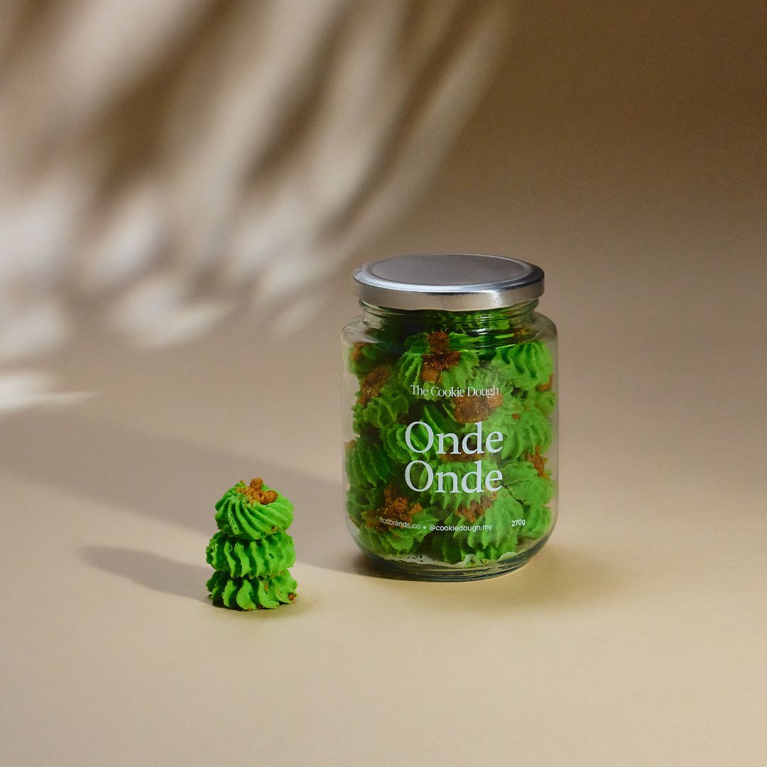 Jar of 'Onde Onde' cookies on a beige background