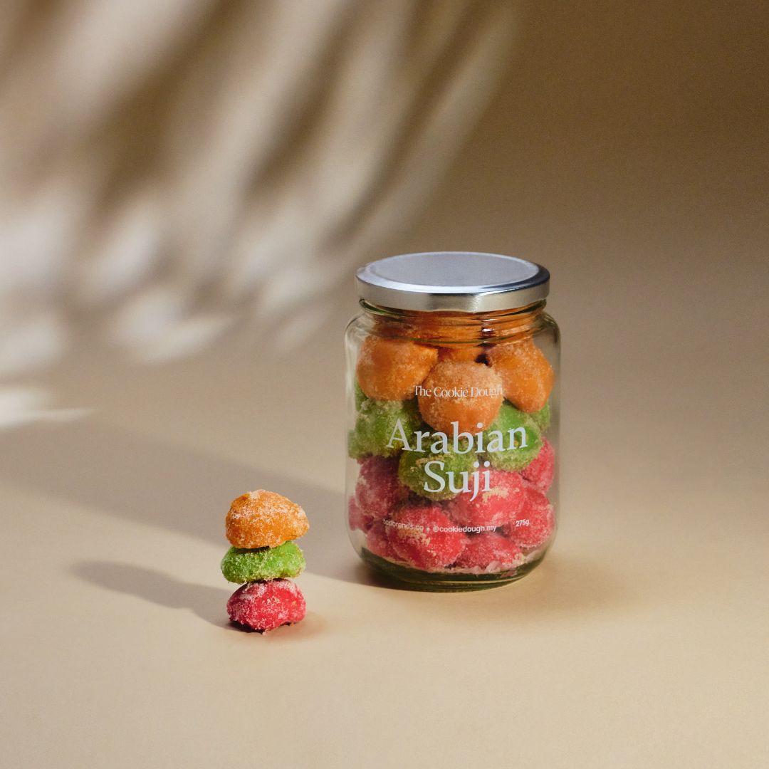 Jar of 'Arabian Suji' with colorful suji balls on a beige background