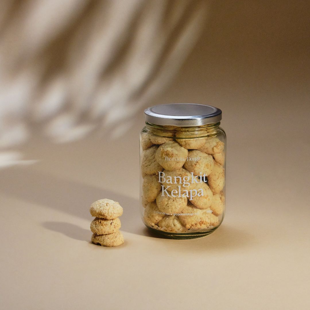 Jar of 'Bangkit Kelapa' cookies on a beige background